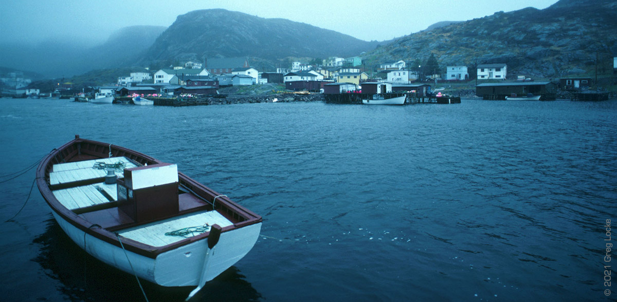 A 35 foot trap skiff tied up in Petty Harbour. Photo by Greg Locke. Copyright © 2021 Greg Locke